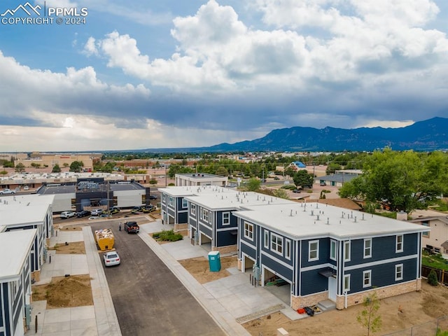 birds eye view of property with a mountain view