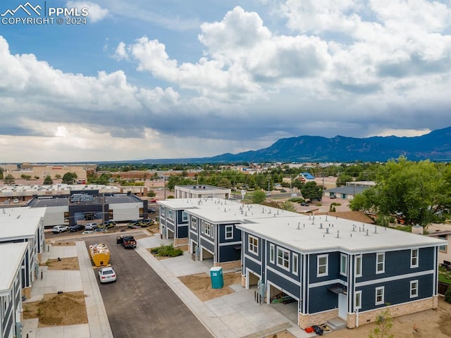 birds eye view of property featuring a mountain view