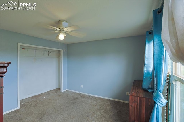 unfurnished bedroom featuring carpet flooring, a closet, and ceiling fan