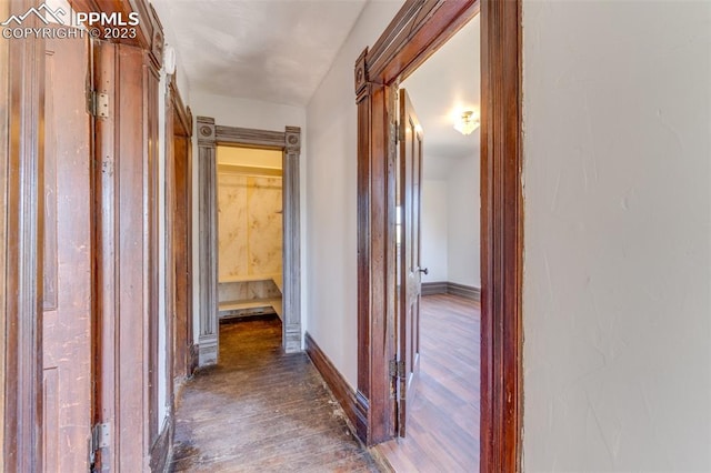 corridor featuring dark wood-type flooring