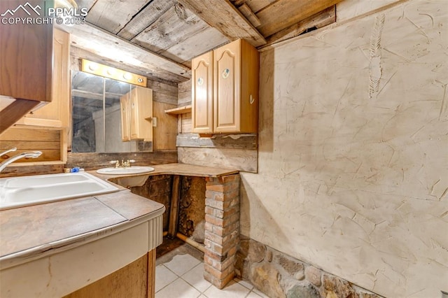 bathroom with tile floors and vanity