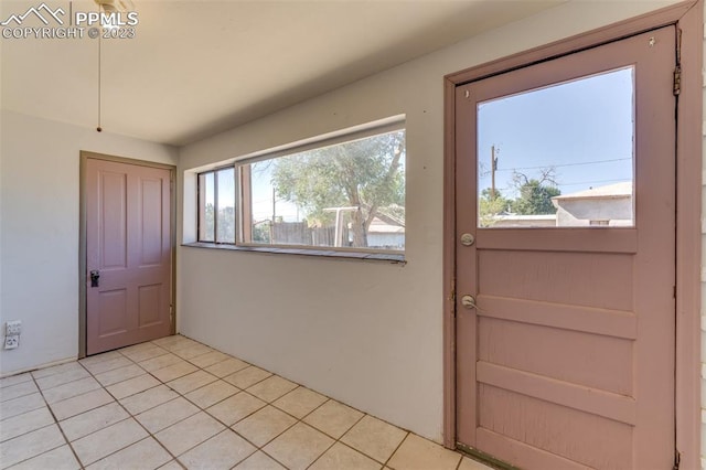 entrance foyer with light tile flooring