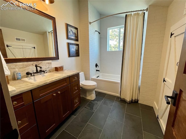 full bathroom featuring tile floors, shower / tub combo with curtain, tasteful backsplash, vanity, and toilet