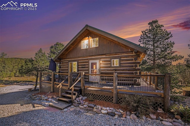 view of front of home with a wooden deck