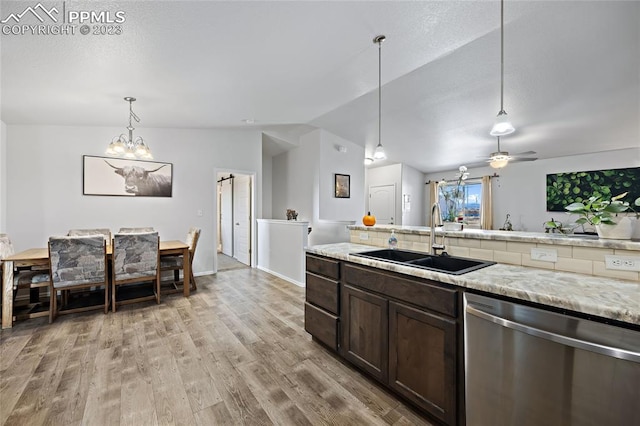 kitchen with hanging light fixtures, ceiling fan with notable chandelier, sink, light hardwood / wood-style flooring, and dishwasher