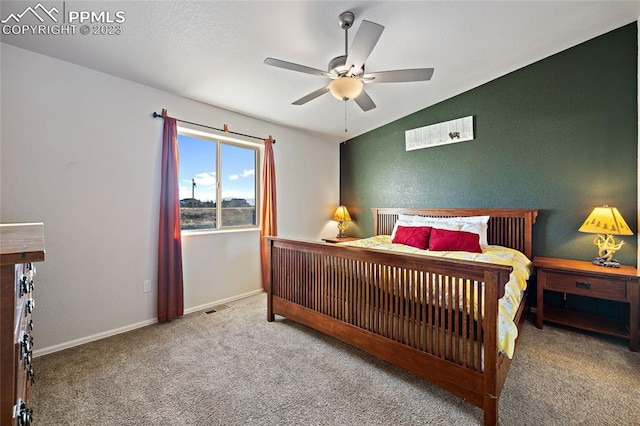 carpeted bedroom with lofted ceiling and ceiling fan