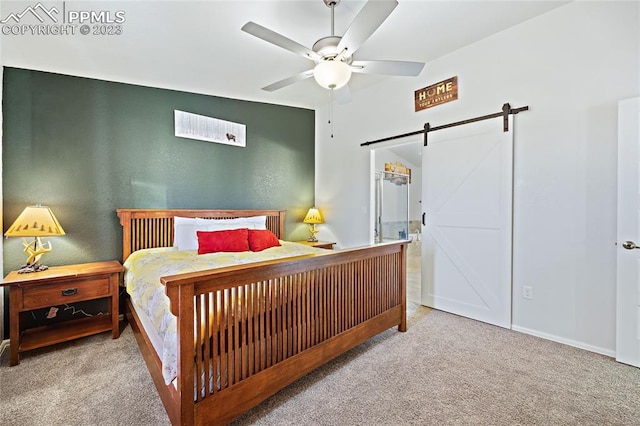 bedroom featuring light carpet, a barn door, and ceiling fan