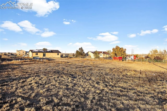 view of yard with a rural view