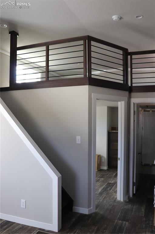 stairs with hardwood / wood-style flooring