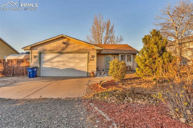 ranch-style house featuring a garage