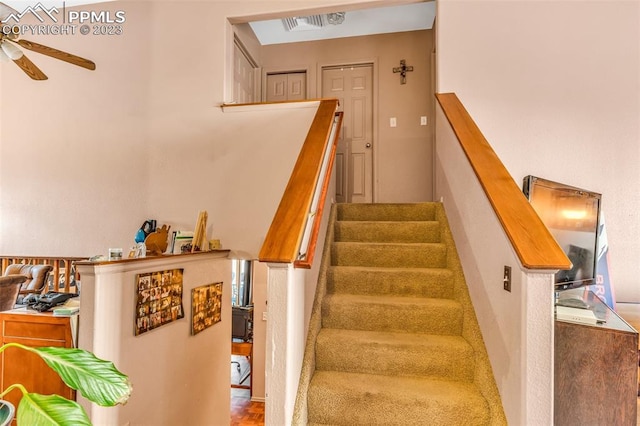 staircase with ceiling fan