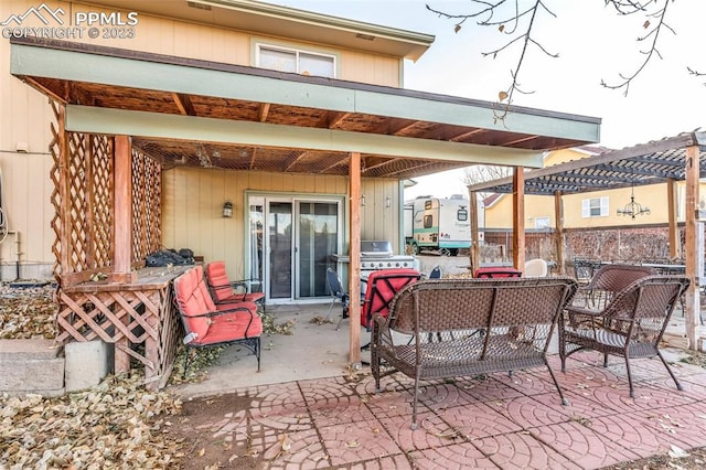 view of patio / terrace featuring a grill and a pergola