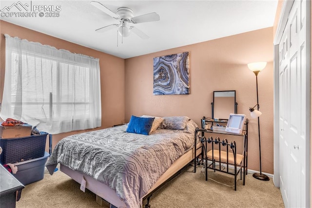 bedroom with ceiling fan and light carpet