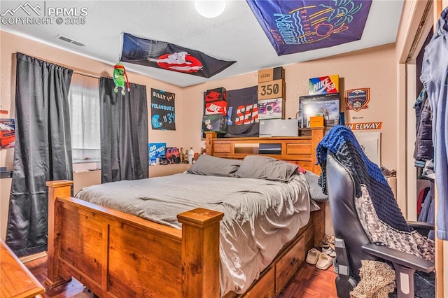 bedroom with parquet flooring