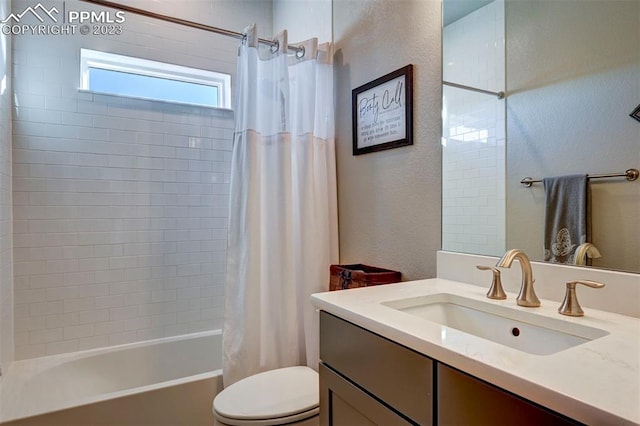 full bathroom featuring toilet, oversized vanity, and shower / tub combo