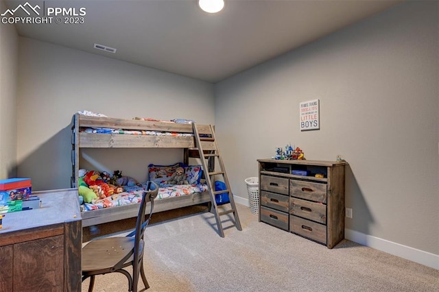 bedroom featuring light colored carpet