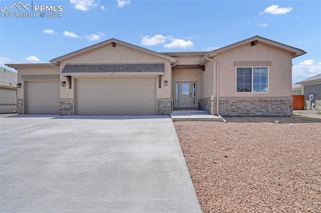 ranch-style house featuring a garage