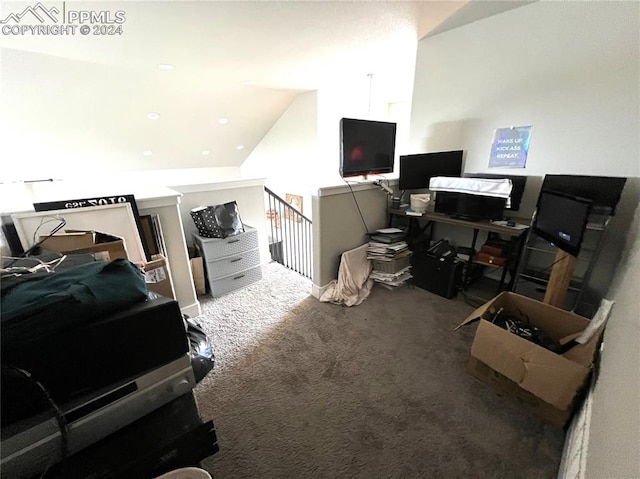 bedroom with carpet floors and vaulted ceiling