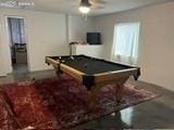 recreation room with billiards and ceiling fan