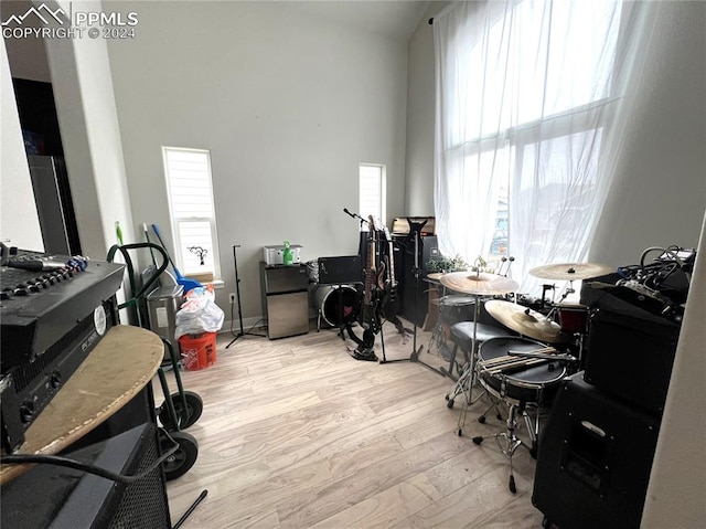 home office with light hardwood / wood-style flooring