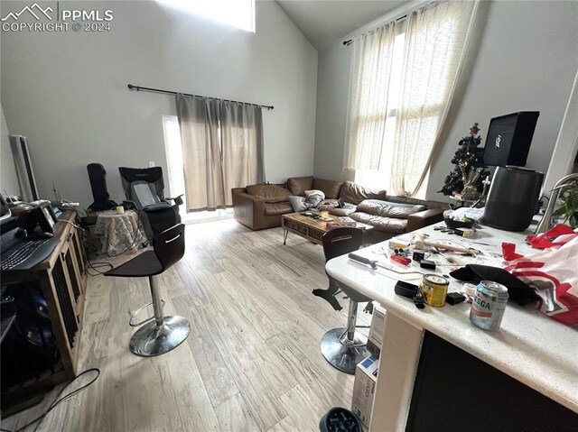 5649 Makalu Dr, Colorado Springs, CO 80924 - living room with light wood-style flooring and lofted ceiling