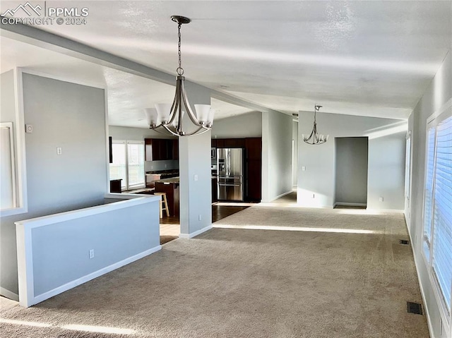 9785 N Calhan Hwy, Calhan, CO 80808 - interior space featuring baseboards, lofted ceiling, an inviting chandelier, and visible vents