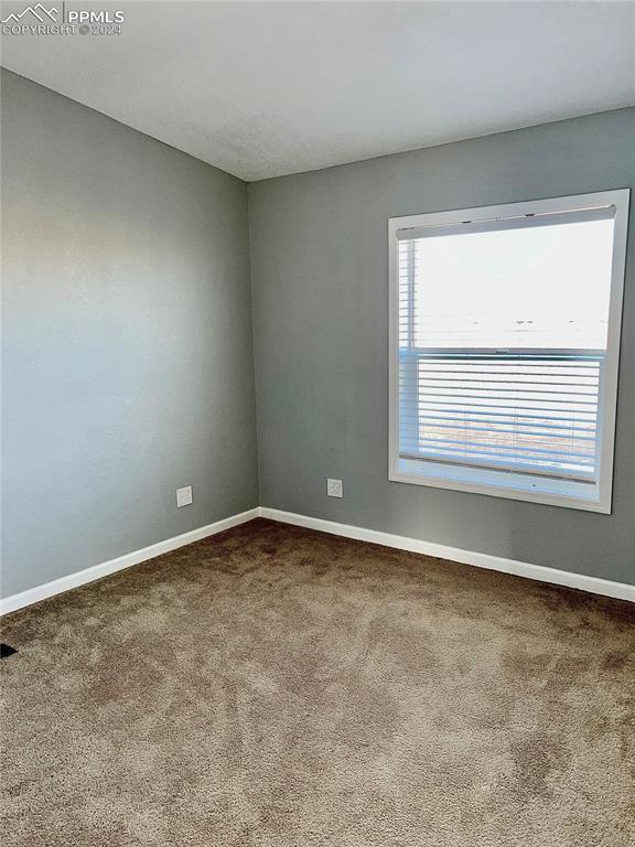 9785 N Calhan Hwy, Calhan, CO 80808 - carpeted empty room with baseboards