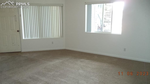 unfurnished room with carpet