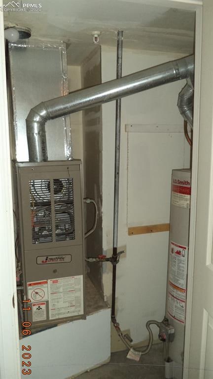 utility room with water heater