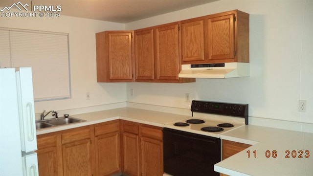 kitchen featuring white appliances and sink