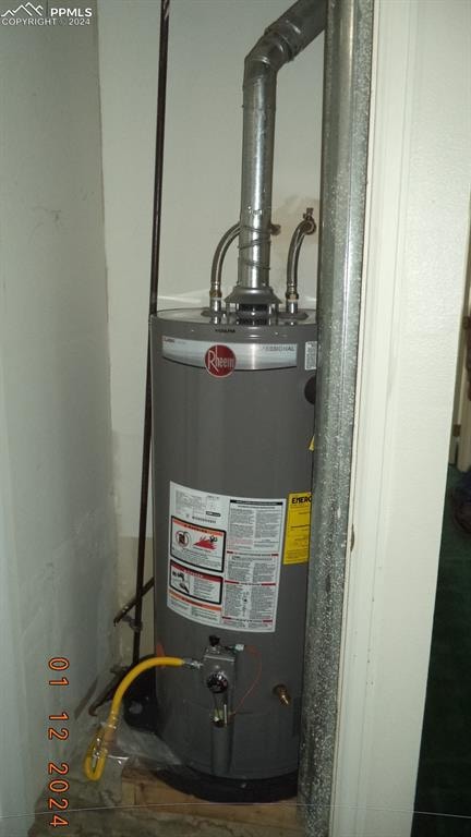 utility room with water heater