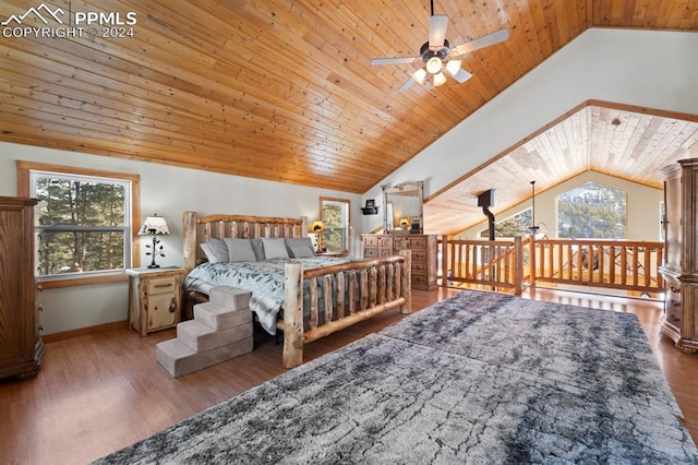 bedroom with wood ceiling, hardwood / wood-style floors, and multiple windows