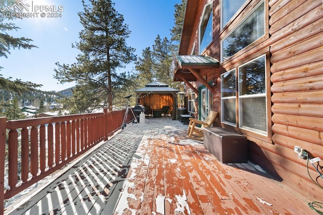 wooden deck featuring a gazebo