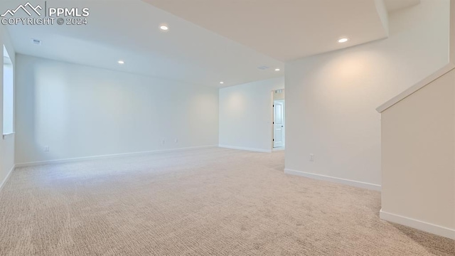 unfurnished living room with light carpet