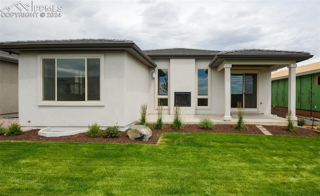 exterior space featuring stucco siding and a patio area