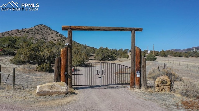 view of gate featuring a mountain view