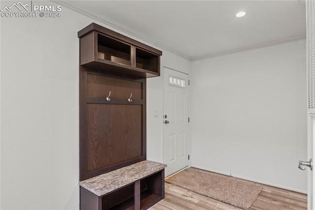 mudroom with crown molding and light hardwood / wood-style floors