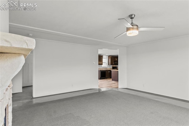 unfurnished living room with ornamental molding, ceiling fan, and light wood-type flooring