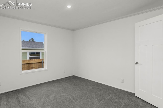 carpeted empty room with crown molding