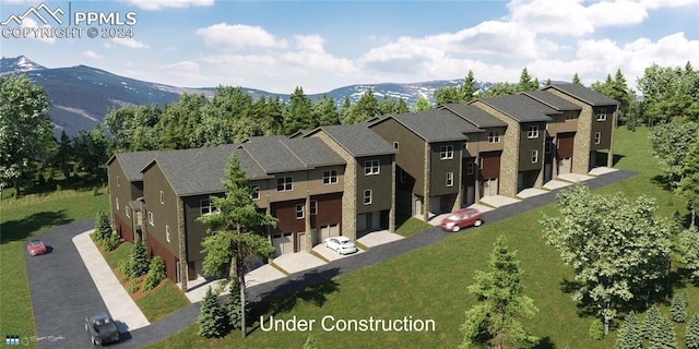 view of front of property with a front yard, a mountain view, and central AC unit