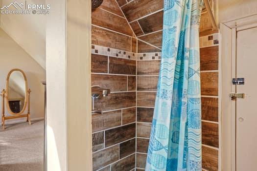 bathroom with a shower with shower curtain