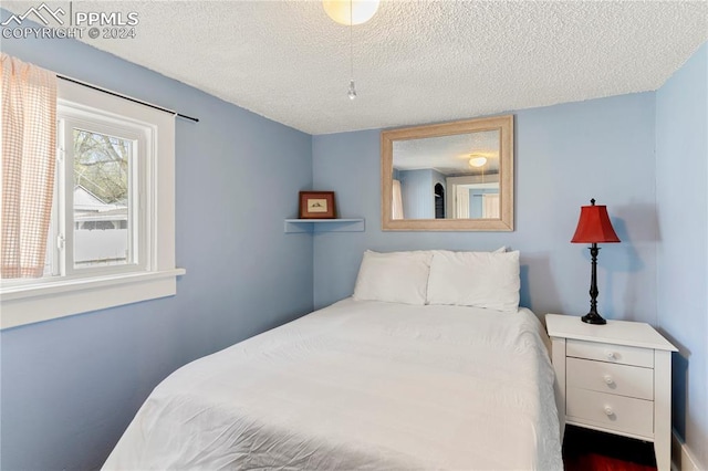 bedroom with a textured ceiling