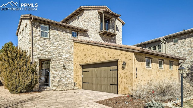 view of front of property with a garage