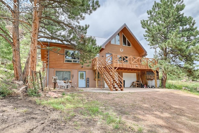 rear view of house with a deck