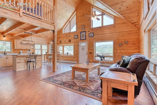 living room featuring high vaulted ceiling and a wealth of natural light