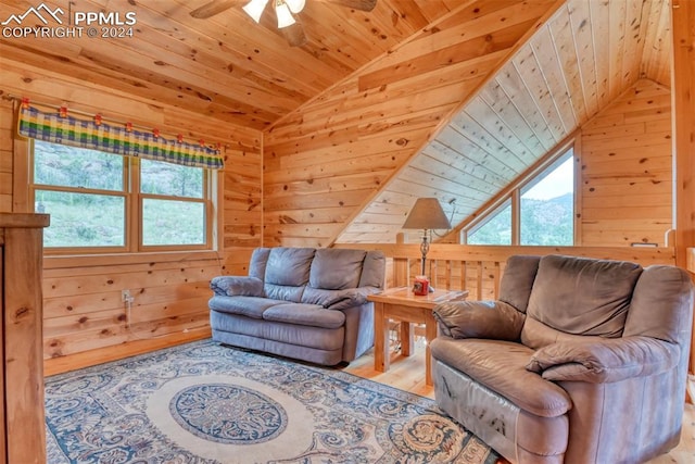 living room featuring vaulted ceiling, light hardwood / wood-style flooring, ceiling fan, and wood ceiling