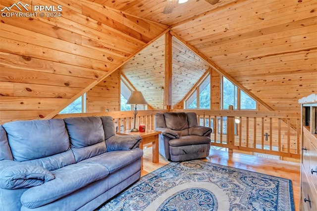 living room with wooden ceiling, light hardwood / wood-style flooring, and vaulted ceiling