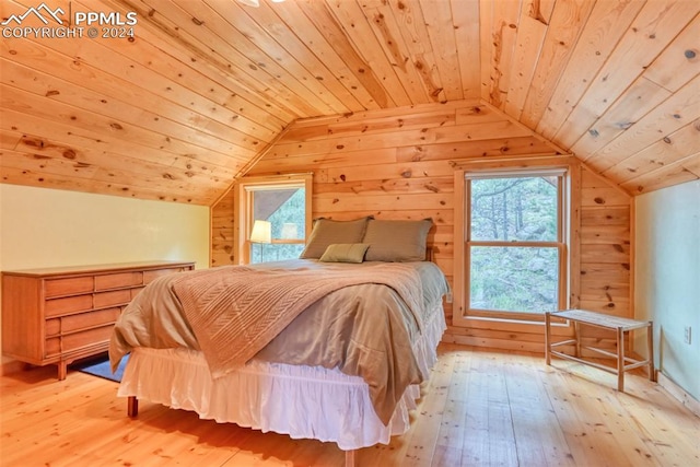 bedroom with wood ceiling, light hardwood / wood-style flooring, and vaulted ceiling