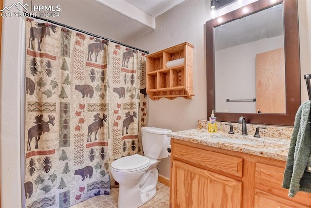 bathroom with toilet, tile floors, and vanity