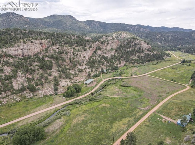 bird's eye view with a mountain view and a rural view